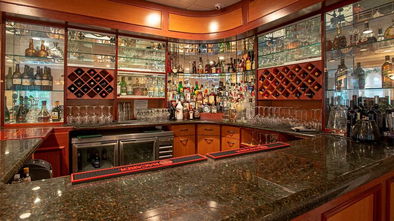 Bar area with view of wine and liquor bottles